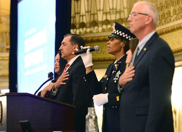 Chicago Police Officer Kenyatta Gaines sings the National Anthem.